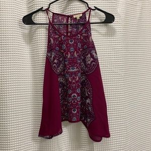 Loose blouse, buttoned down from the back.